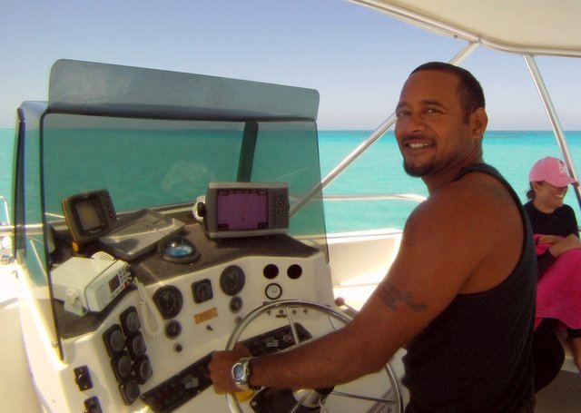 Capt Alex Edwards driving a Custom Pro 48 Dive Boat in Belize